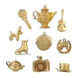 Ten 9ct gold pendant/charms including poodle