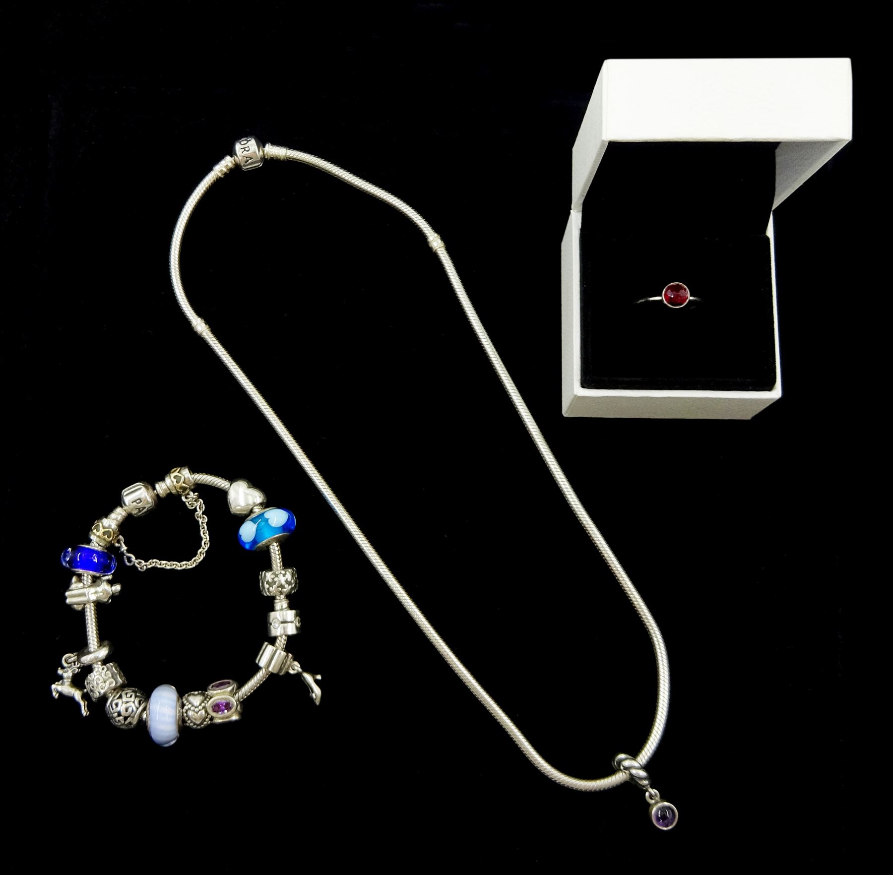 Collection of silver Pandora jewellery comprising a bracelet with thirteen Pandora charms and safety