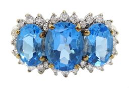 9ct gold three stone oval blue topaz and diamond cluster ring