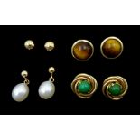 Four pairs of 9ct gold stud earrings
