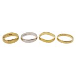 Three yellow gold wedding bands and a white gold wedding band