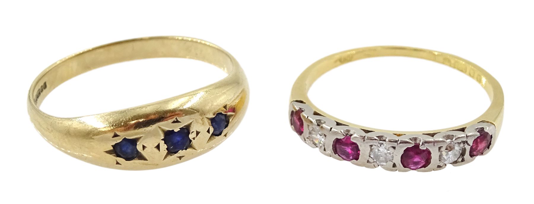 18ct gold ruby and diamond half eternity ring and a 9ct gold gypsy set three stone sapphire ring