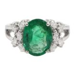 18ct white gold oval cut emerald and round brilliant cut diamond ring