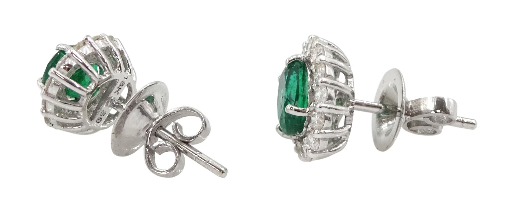 Pair of white gold oval cut emerald and round brilliant cut diamond cluster stud earrings - Image 2 of 2