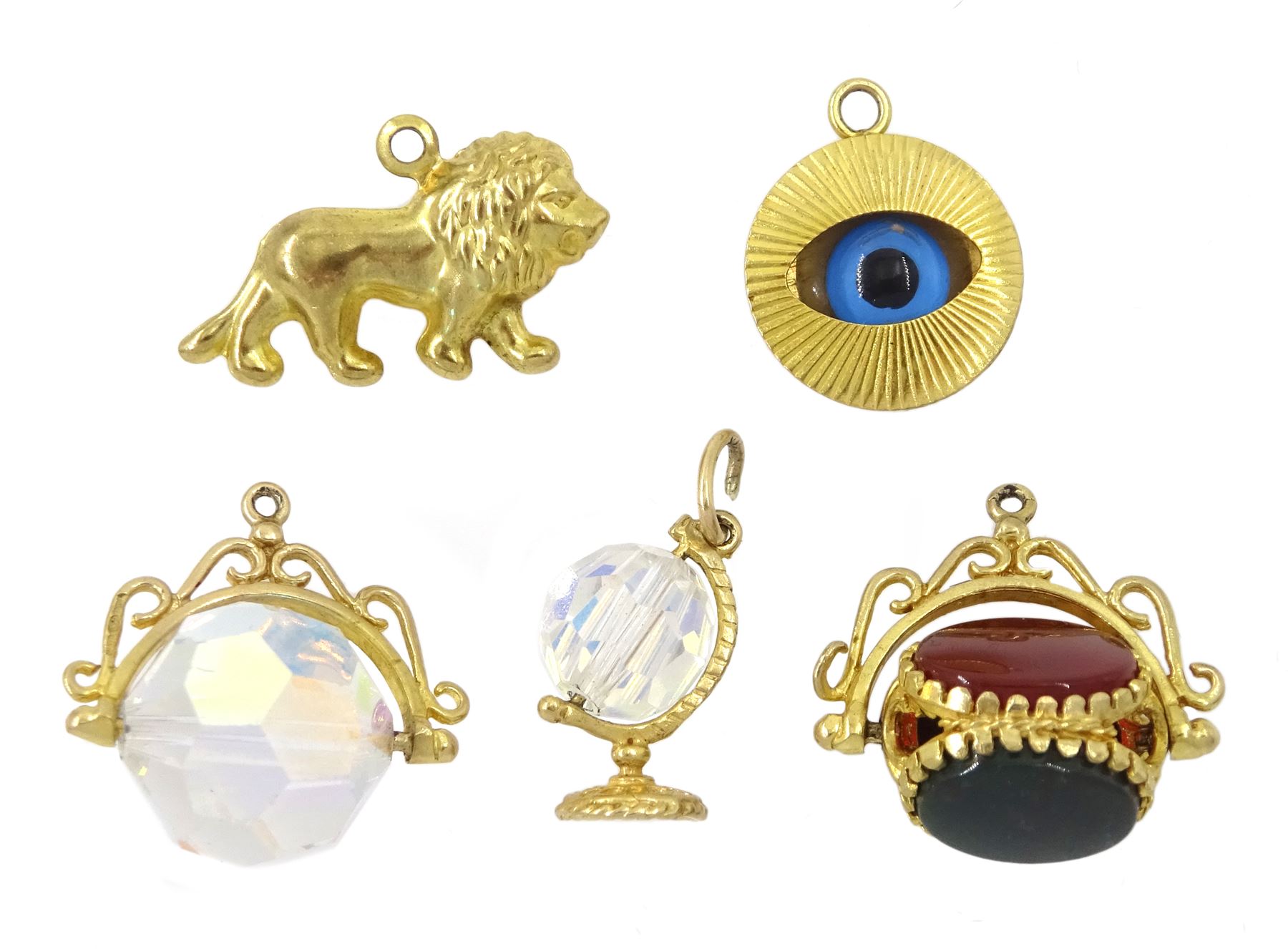 Five 9ct gold pendant/charms including onyx
