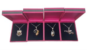 Four silver amber pendant necklaces