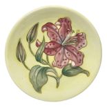 Moorcroft Tiger Lily pattern plate on a yellow ground