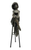 Art Deco style bronze modelled as a female figure seated cross legged upon a chair