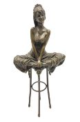 Art Deco style bronze modelled as a female figure seating crossed legged upon a chair