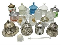 Collection of glass beehive honey pots
