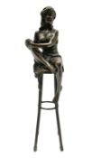 Art Deco style bronze modelled as a female figure seated upon a chair