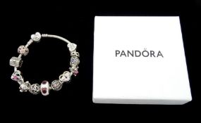 Silver Pandora bracelet with four Disney charms including Minnie Mouse