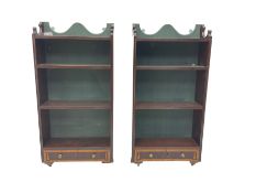 Pair of mahogany wall hanging shelf units