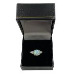 Silver-gilt three stone opal ring