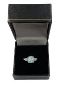 Silver-gilt three stone opal ring