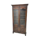 Early 20th century oak bookcase on cupboard