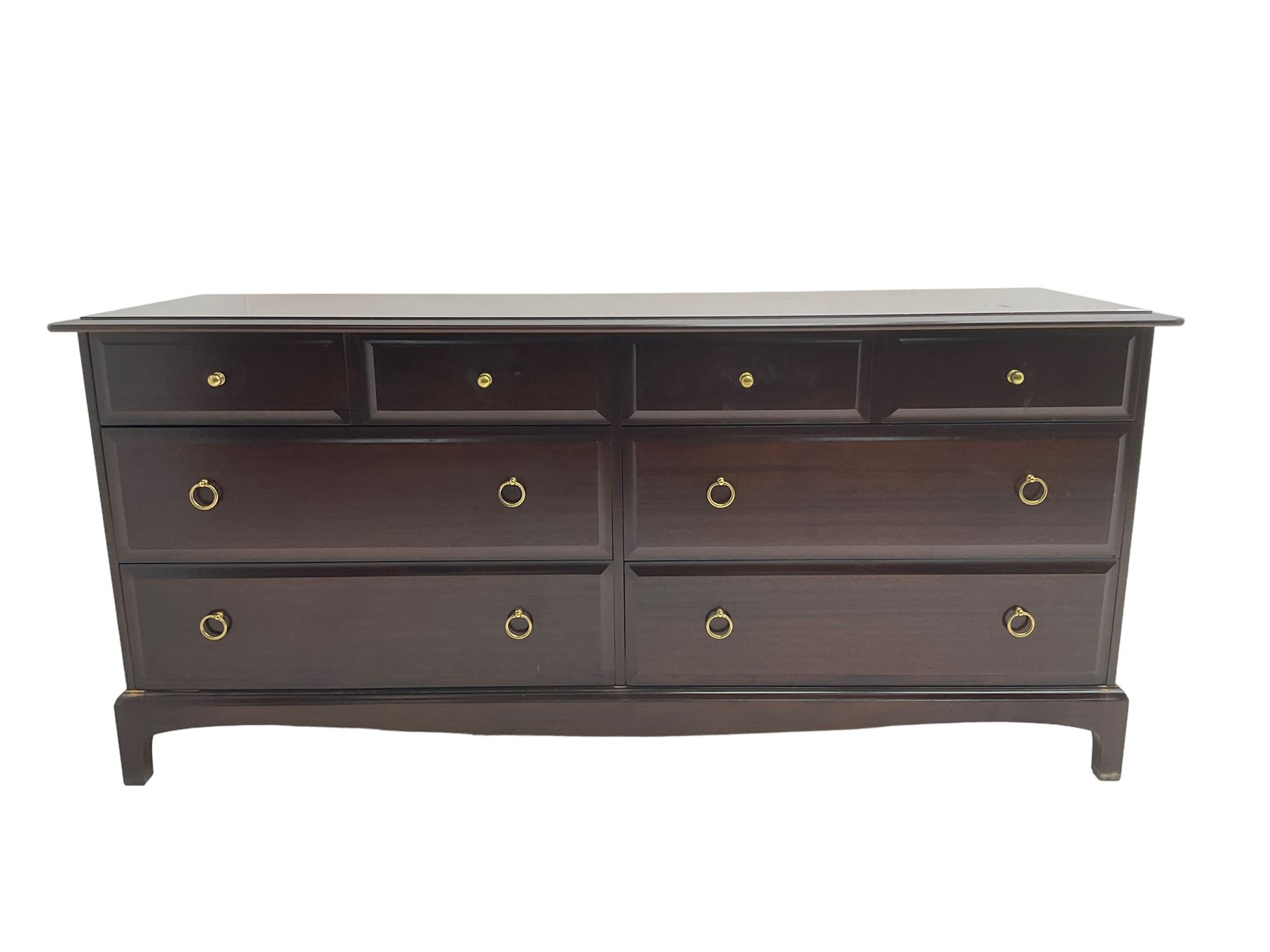 Stag Minstrel - mahogany low chest or sideboard. fitted with four short and four long drawers