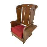 Arts and Crafts design oak reading wingback armchair