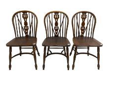 Set three late 20th century country oak Windsor chairs