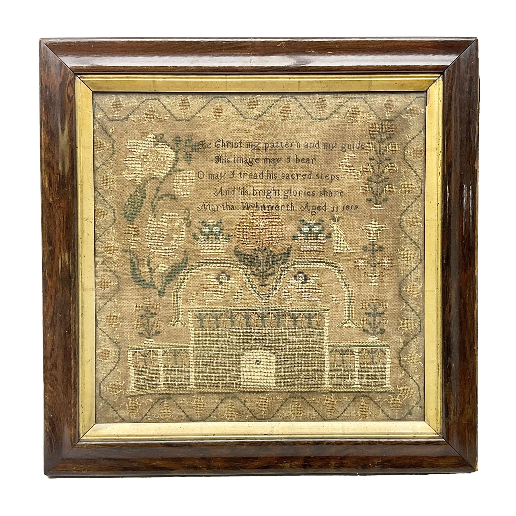 Victorian needlework sampler showing a mansion with cherubs and flowers
