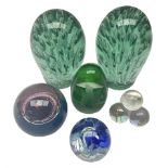 Pair of Victorian green glass dump paperweights with air bubble inclusions