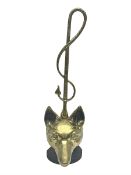 Brass fox mask and hunting whip door stop