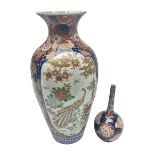 Large Imari vase of baluster form the panels depicting peacocks in a garden setting