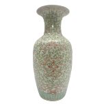 Large Chinese vase of baluster form with foliate decoration upon a white ground