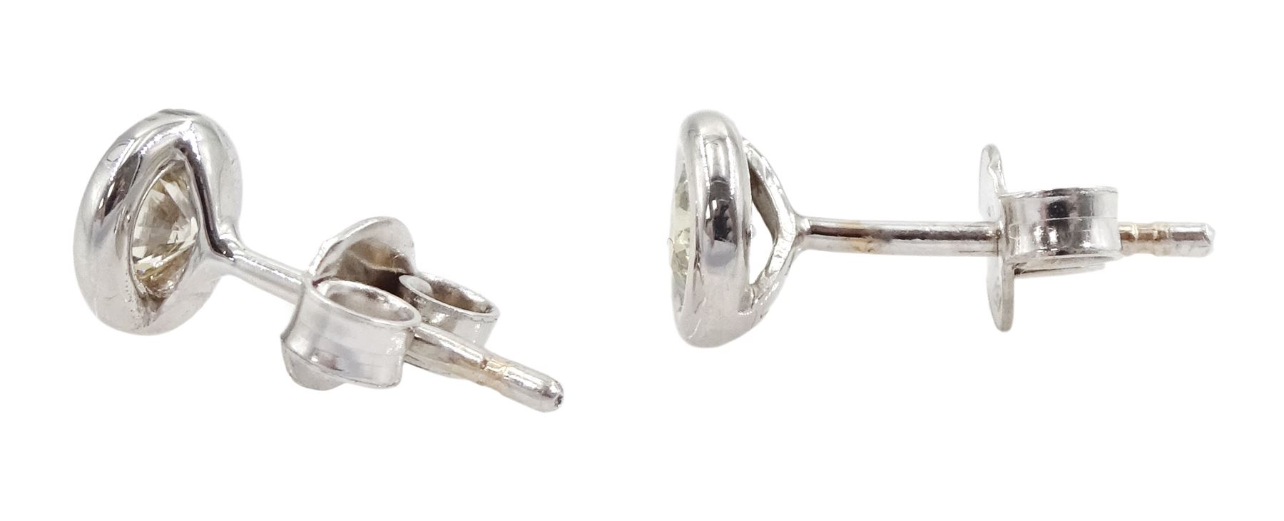 Pair of 14ct white gold bezel set round brilliant cut diamond stud earrings - Image 2 of 2
