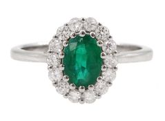 18ct white gold oval emerald and round brilliant cut diamond cluster ring