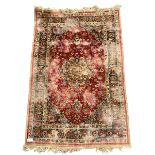 Antique Persian red ground rug