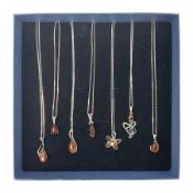 Seven silver Baltic amber pendant necklaces