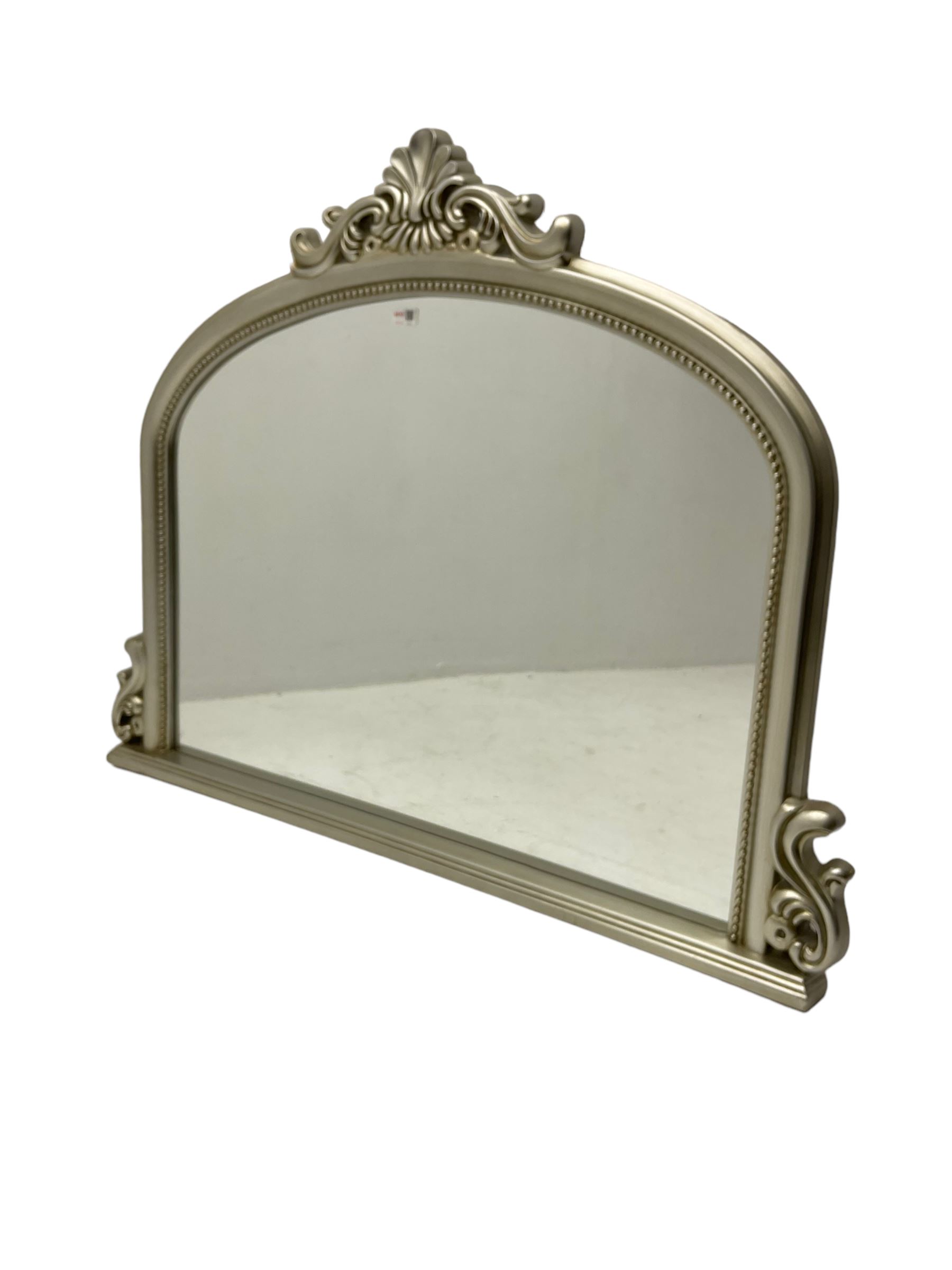 Arch top overmantle mirror in silvered frame