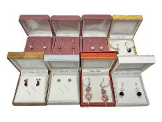 Eight pairs of silver stone set earrings