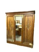 Late 19th century Arts and Crafts pitch pine triple wardrobe