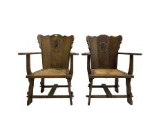 Pair Arts and Crafts oak armchairs