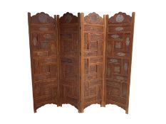 Indian heavily carved hardwood four panel screen