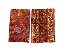 Two Persian crimson ground rugs