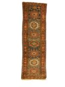 Antique Turkish Heriz red ground runner rug
