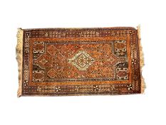 Baluchi red and amber ground rug