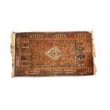 Baluchi red and amber ground rug