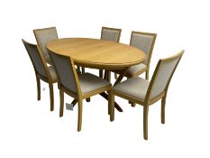 Contemporary light oak oval extending dining table