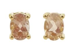 Pair of 9ct gold single stone oval cut morganite stud earrings