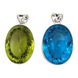 Two large silver green and blue stone set pendants