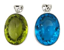 Two large silver green and blue stone set pendants