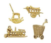 Four 9ct gold pendant/charms including paddle wheel steam boat