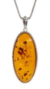 Silver oval Baltic amber pendant necklace