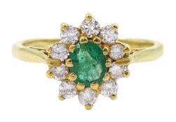 18ct gold oval emerald and round brilliant cut diamond cluster ring