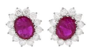 Pair of 18ct white gold oval ruby and round brilliant cut diamond cluster stud earrings