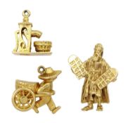 Three 9ct gold gold pendant/charms including Moses and the ten commandments